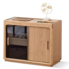 a wooden cabinet with a fan on top of it