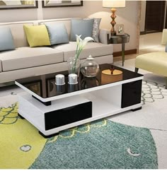 a living room filled with furniture and a coffee table in front of a white couch