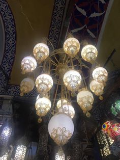 a chandelier hanging from the ceiling in a building