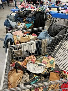 a shopping cart filled with lots of clothes