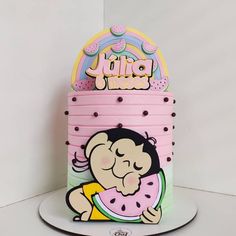 a pink cake with a cartoon character on it