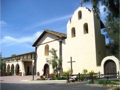 an old church with a cross on the front