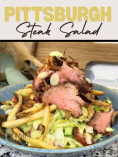 a blue bowl filled with meat and french fries on top of a marble countertop