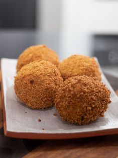 some food is sitting on a plate on a wooden table and ready to be eaten