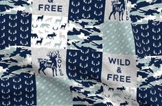 a blue and white fabric with deer, moose, and letters on it that say man