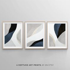 three abstract paintings hanging on the wall in a white and black color scheme with text that reads,'neptune art prints / on etsy '