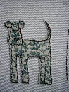 a close up of a dog on a piece of cloth