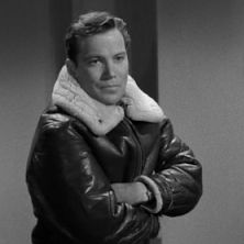 black and white photograph of man in leather jacket