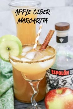 an apple cider margarita is garnished with cinnamon