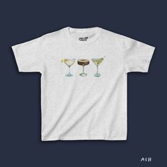 Introducing our Tini Time Baby Tee featuring your favorite hand-drawn cocktails in a spectrum of vibrant colors. Savor the martini medley: Espresso Martini, Dirty Martini, Dry Martini... The choice is yours - shaken or stirred? Our Tini Time Baby Tee is tailor-made for those who appreciate life's finer, more indulgent moments. Drawn Cocktails, Martini Espresso, Martini Print, Dry Martini, Graphic Baby Tee, Dirty Martini, Chill Fits, Y2k Baby Tee