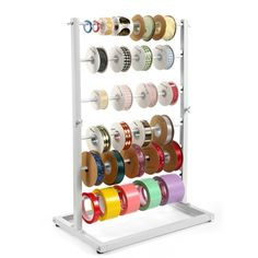 a rack with many different colored tapes and spools on it's sides