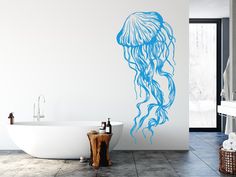 a bathroom with a bathtub and wall decal in the shape of a jellyfish