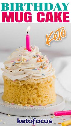 a birthday cake with white frosting and a lit candle on top that says ketofocus