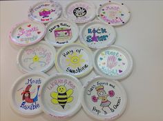 there are many plates that have different designs on them, and one is for each child's name