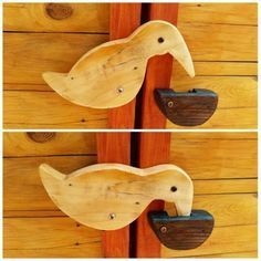 two pieces of wood that have been made to look like birds on the door handles