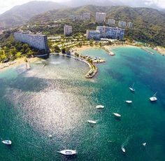 an aerial view of boats in the water