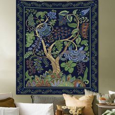 a tapestry hanging on the wall in a living room