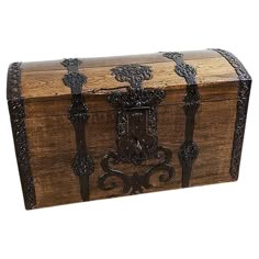 an old wooden trunk with iron decorations on it