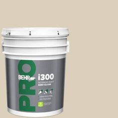 a bucket of behr paint with the words behr in green and white on it