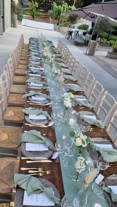 a long table set up with place settings