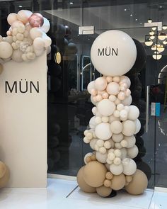 there are many balloons on display in the store