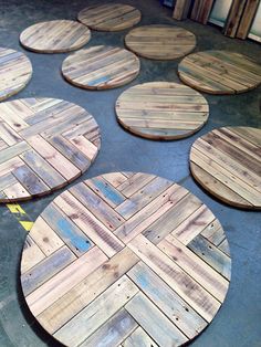 several wooden coasters laid out on the floor