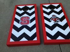 two red and black striped cornhole boards with the number six painted on each side