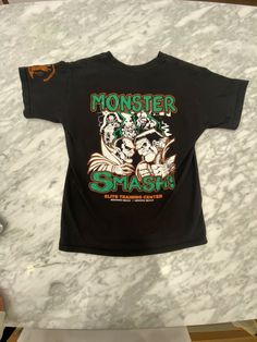 Y2K Monster Smash Elite Training Center Hermosa Beach Graphic T-Shirt Youth L gently used sold as is Hermosa Beach, Redondo Beach, Training Center, Graphic T Shirt, Graphic Tshirt, Train, Mens Graphic Tshirt, Mens Tshirts, Mens Tops