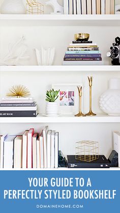 white shelves with books, vases and pictures on them