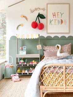 a bedroom with a bed, shelves and pictures on the wall above it that says hey kid