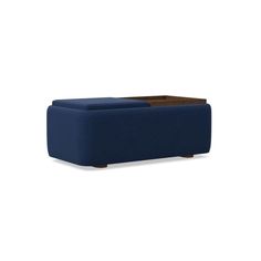 a blue ottoman that is sitting on the floor