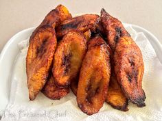 grilled bananas sitting on top of a white plate