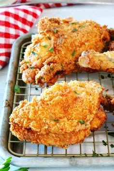 fried chicken on a baking rack with parsley