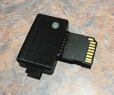 a close up of a memory card attached to a device