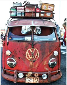 an old vw bus with luggage on top