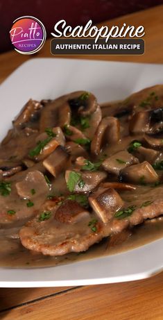 a white plate topped with meat covered in mushroom gravy