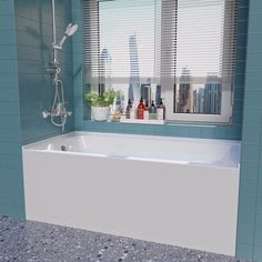 a bath tub sitting under a window in a bathroom