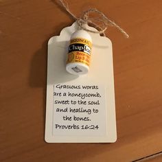 a white tag with a message on it that says gracious words are a honeycomb, sweet to the soul and helping to the bones prove prove prove prove