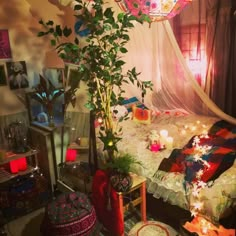 a living room filled with lots of furniture and flowers on top of a table next to a window