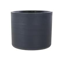 a black pot sitting on top of a white table