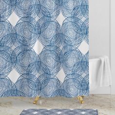 a shower curtain with blue circles on it