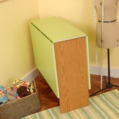 a mannequin is next to a dress form in a room with yellow walls