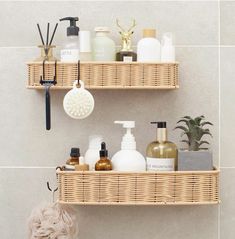 two wicker shelves with soap, lotion and other bathroom items on them in a bathroom