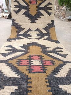 an old rug is laying on the ground