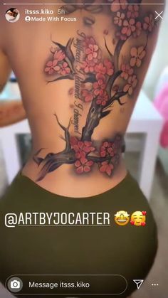 the back of a woman's body with flowers on it and an inscription that reads,