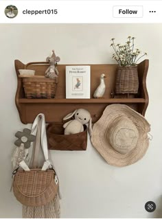 there is a shelf with baskets and hats on it, along with other items such as purses