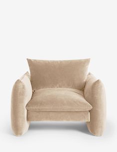 a beige chair with a pillow on the back and armrests, in front of a white background