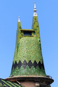 the top of a building with a clock on it