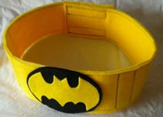 a close up of a batman belt on a white surface