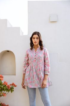 🌷  MONSOON LOTUS Add a splash of colour to your wardrobe with our Monsoon Lotus in vibrating floral motifs. Monsoon Lotus was created for a comfortable loose fit, and decorated with traditional hand block prints. Sizings: Size S:   Shoulders 38cm - 14.9" Bust  92cm - 36.2" Length approx. 72cm - 28.3" Size M:   Shoulders 40cm - 15.7" Bust  102cm - 40.1" Length approx. 72cm - 28.3" Size L:   Shoulders 42cm - 16.5" Bust  108cm - 42.5" Length approx. 72cm - 28.3" Size XL: Shoulders 43cm - 16.9" Bus Pink Bohemian Relaxed Fit Blouse, Casual Pink Cotton Kurta, Pink Bohemian Printed Tunic, Spring Casual Tunic With Printed Motifs, Pink Printed Tunic Blouse, Casual Summer Tunic With Printed Motifs, Casual Pink Summer Kurta, Summer Long Sleeve Kurta With Yoke, Bohemian Style Summer Kurta With Yoke Detail